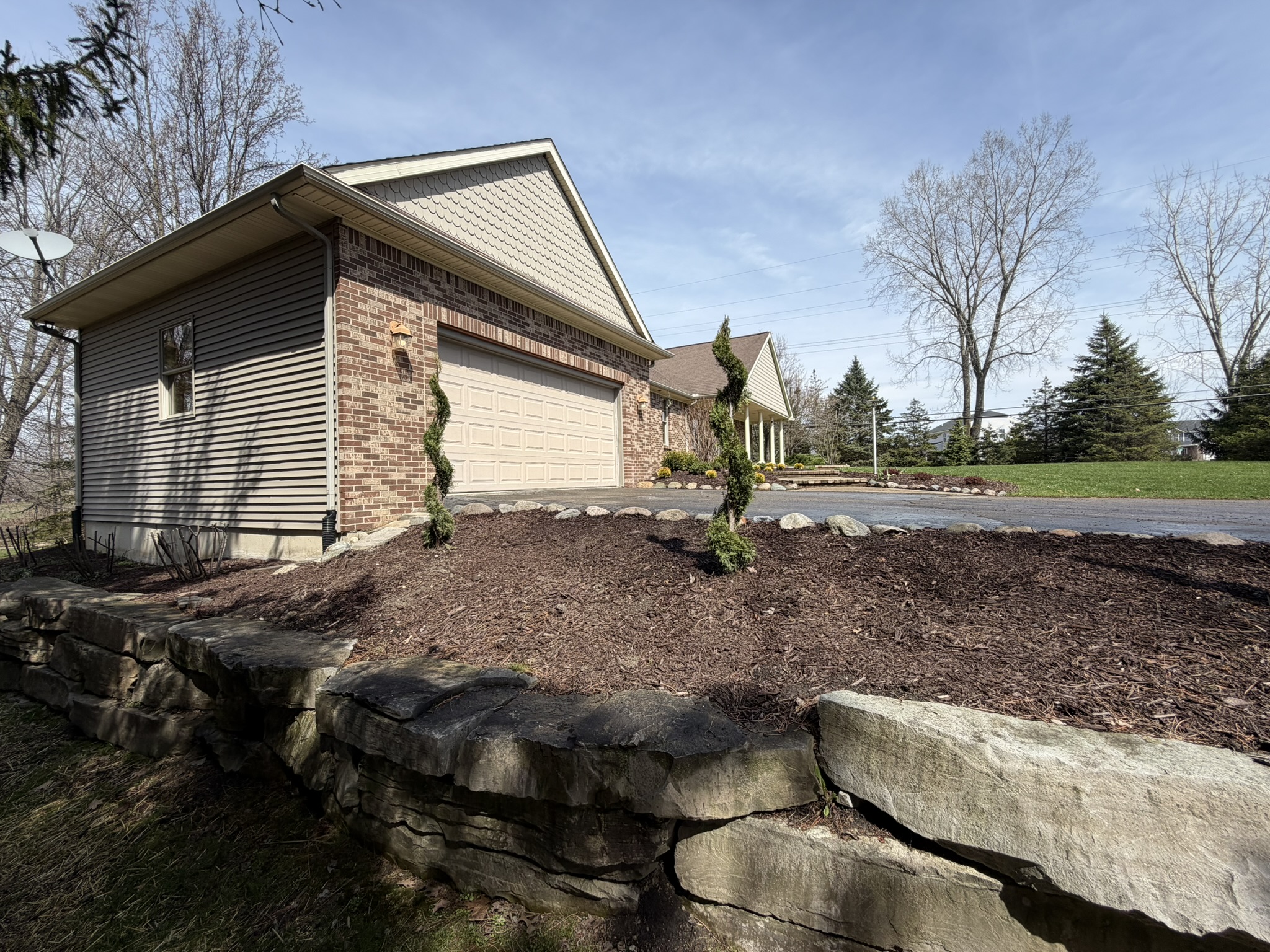 Custom front rock wall and professional landscaping