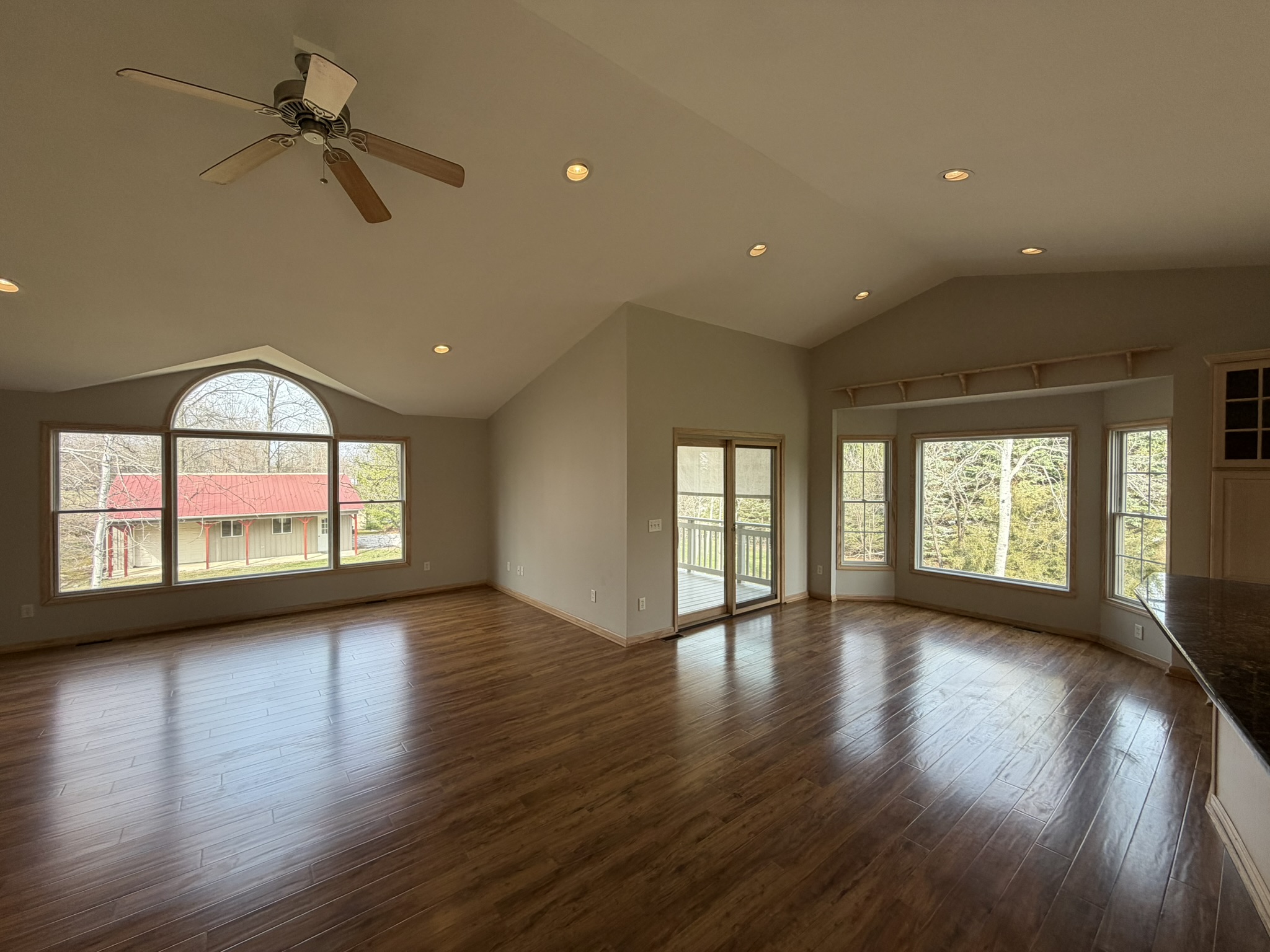 Vaulted great room with hardwood floors