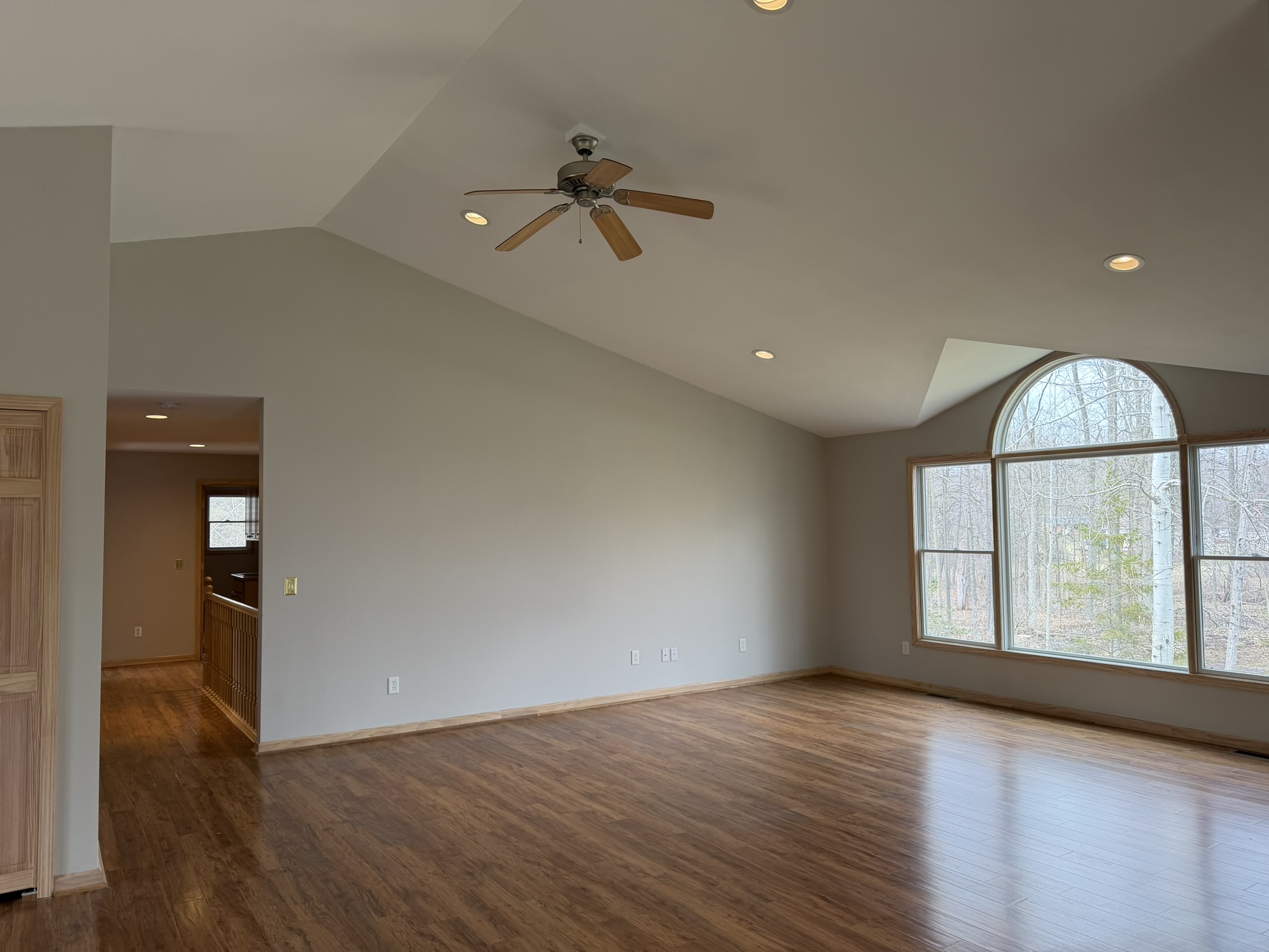 Great room — deck door and wooded views