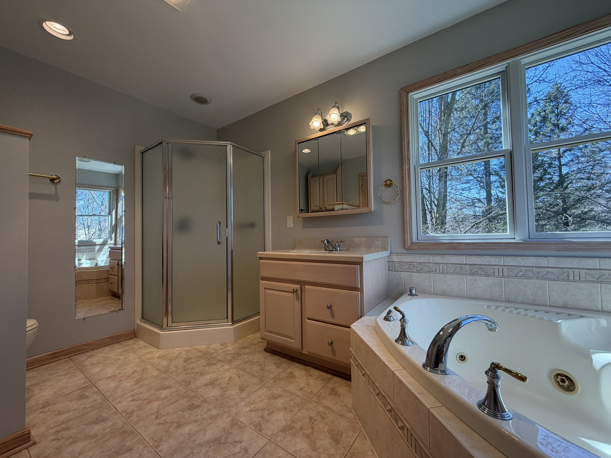 Primary bath — jetted tub with corner windows