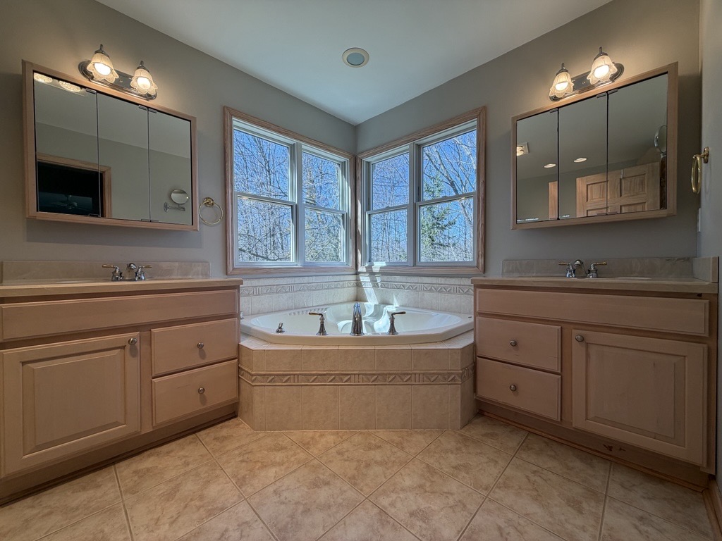 Primary bath — jetted tub with corner windows